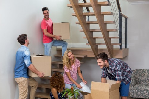Professional removals team handling a Westealing property move
