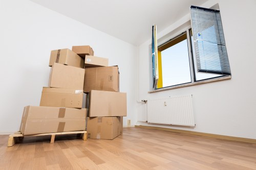 Local removals van service navigating a residential street