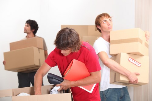 Low-carbon removals van loading sorted waste and reusable furniture