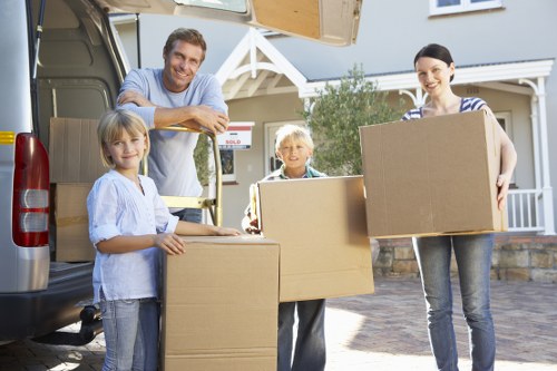 Packed moving boxes and furniture loaded for transport
