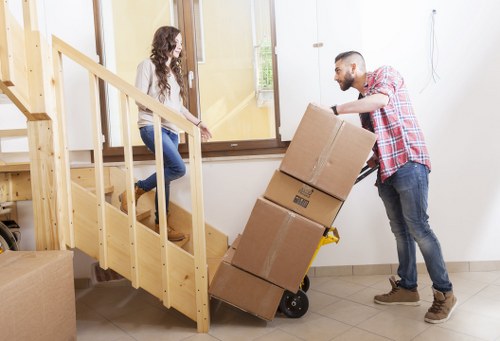 Loading furniture and boxes into a van for a Westealing house move